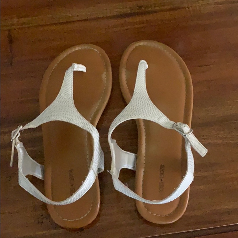 Brown and white strapped sandals